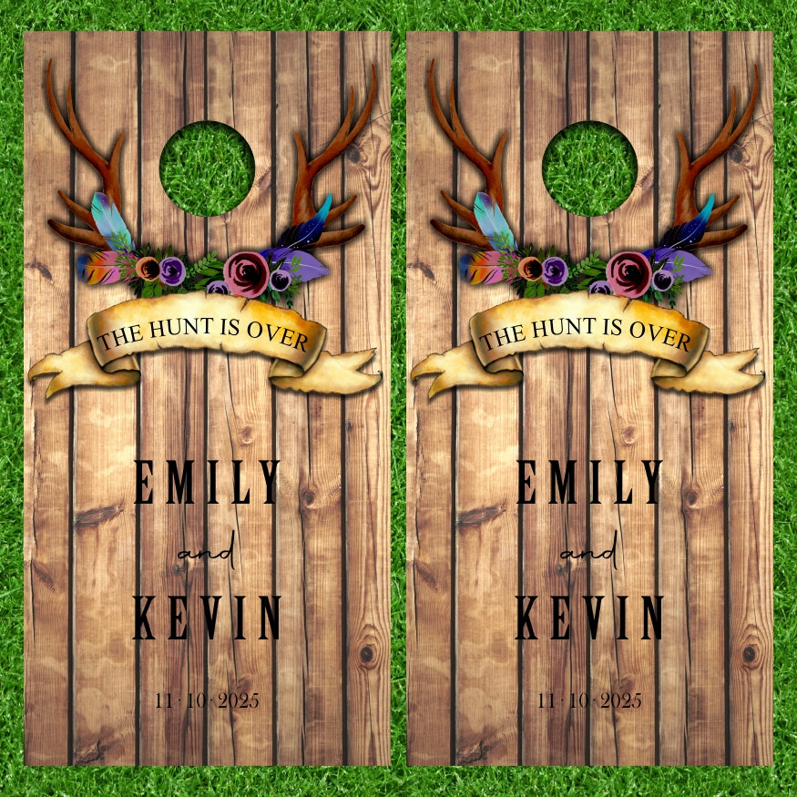 Customize Your Name on this Wedding Monogram Date Established The Hunt Is Over Deer Antlers Brown Wood Background Cornhole Wraps