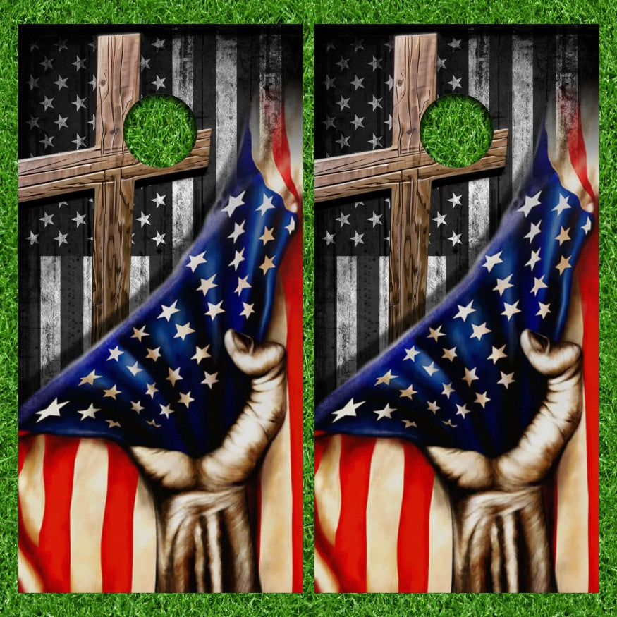 Strong Hand Pulling American Flag over Brown Wooden Cross Cornhole Wraps