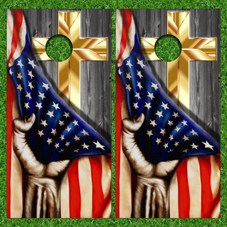 Hand Pulling the American Flag to Reveal Golden Cross Cornhole Wraps